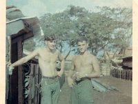 Dave Hess (L) and Pete Petras  by Personnel Hooches at Quan Loi - 1969