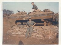 Pete Petras (Standing) Sgt Edmund "Eddie Zak" Zakrzewski  on top of one of the Quan Loi guard bunkers